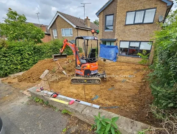 image of l.c.s. driveways starting a new project with a mini digger
